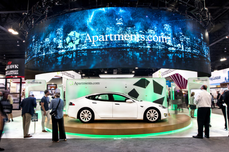 tesla car at apartments.com booth