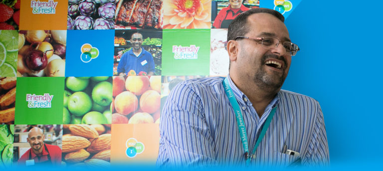 man laughing at Kroger booth